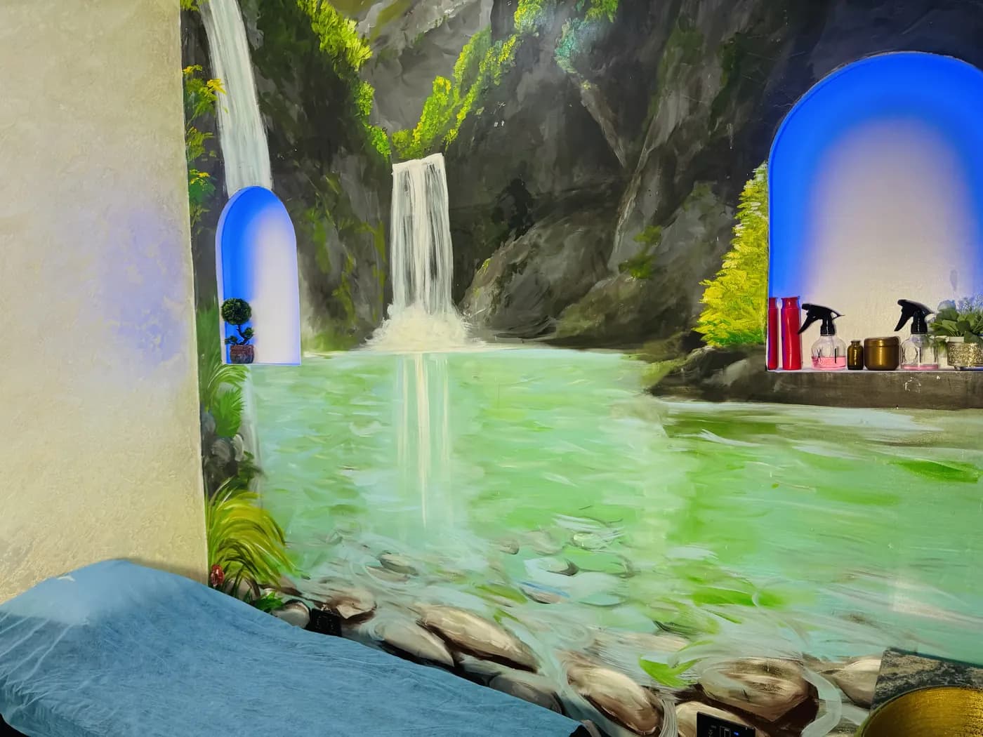 Waterfall mural above a treatment bed
